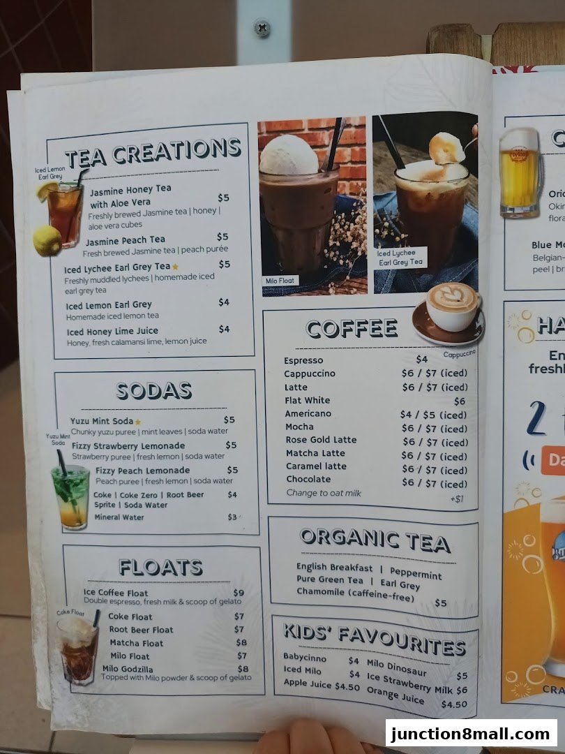 A menu featuring tea creations, sodas, coffee, organic tea, floats, and kids' favorites.