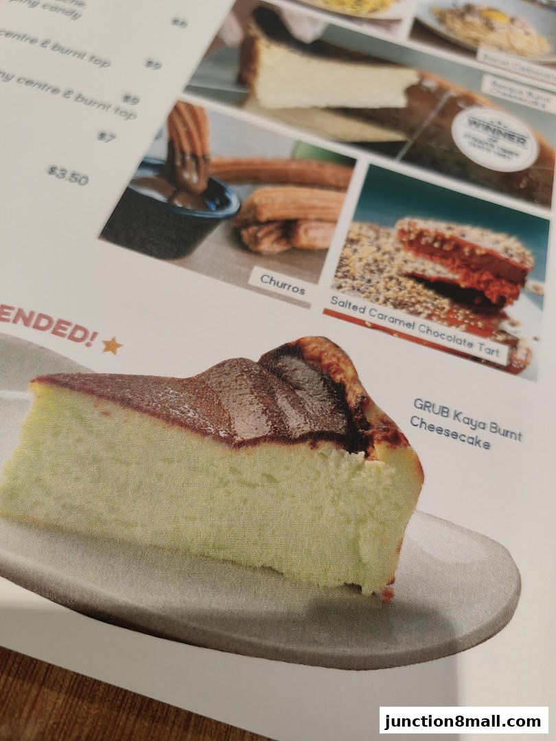 A menu featuring desserts like cheesecake, churros, and tart, with prices listed.