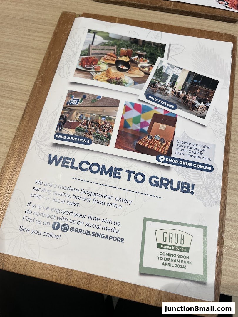 A welcome brochure for GRUB Junction 8, showcasing food and store locations.
