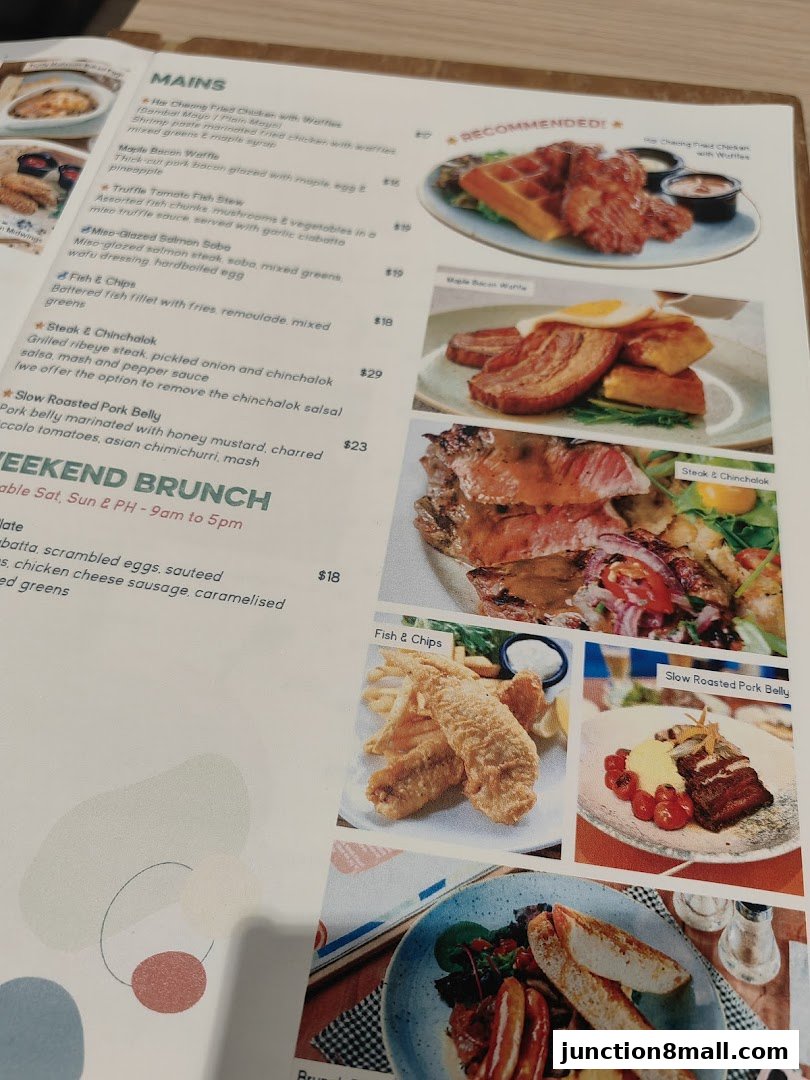 A menu from GRUB Junction 8 featuring mains and weekend brunch options with food photography.