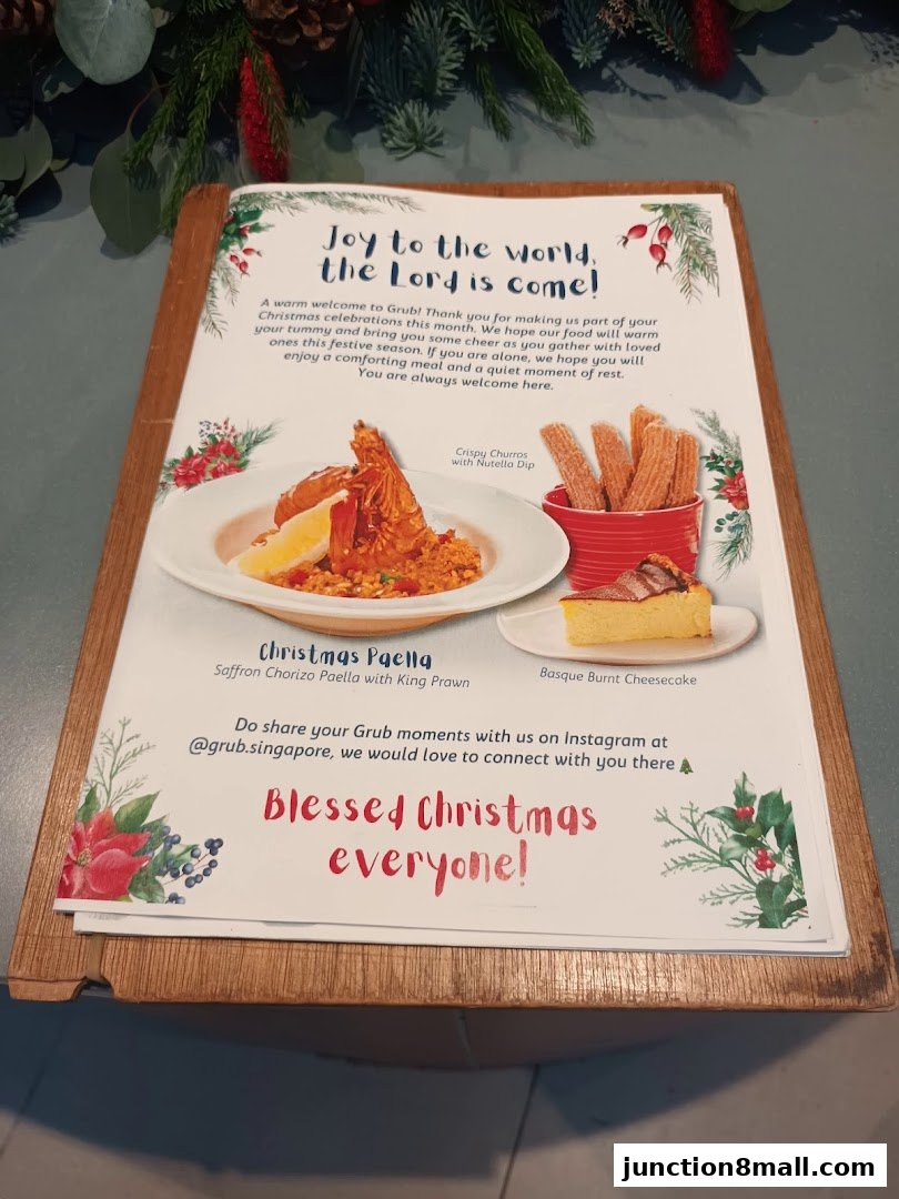 A Christmas-themed menu from GRUB Junction 8 featuring paella, churros, and cheesecake.