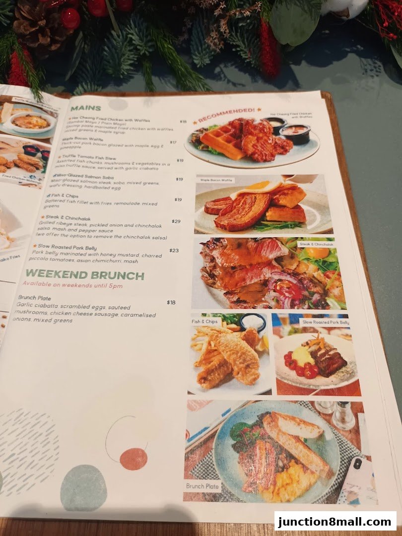 A menu from GRUB Junction 8 featuring mains and weekend brunch options with food photography.