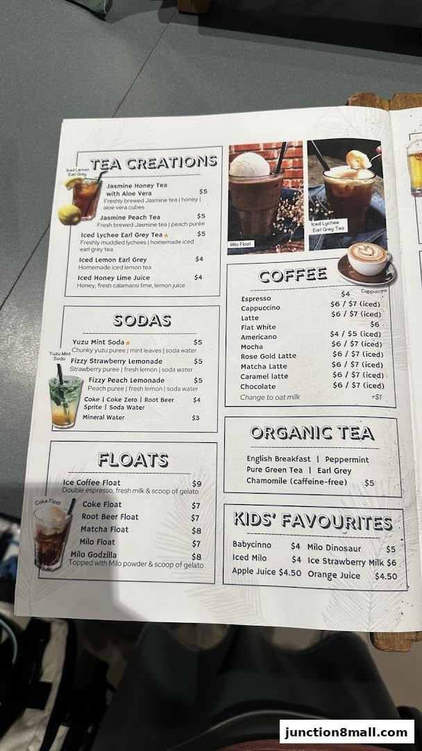 A menu from GRUB Junction 8 featuring teas, coffees, sodas, floats, and kids' favorites.