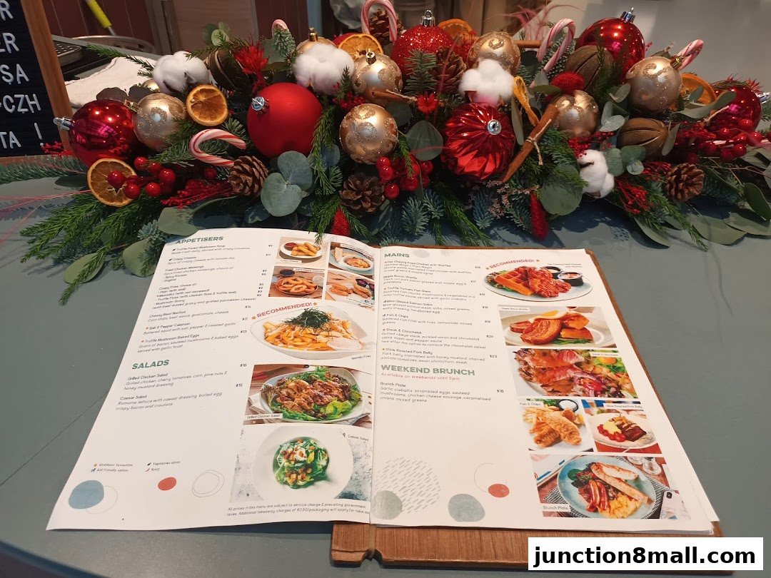 A menu from GRUB Junction 8 with festive holiday decorations.
