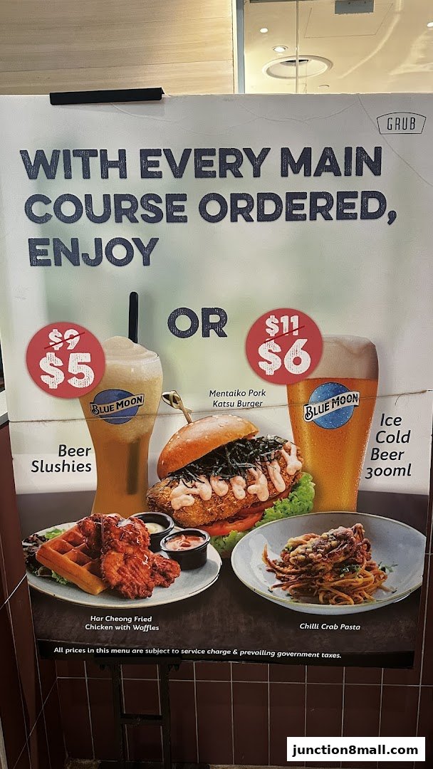 A promotional poster for GRUB Junction 8 featuring main courses and drink specials.