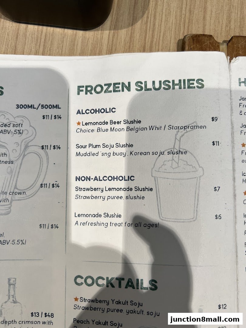 A menu featuring frozen slushies and cocktails with prices and descriptions.