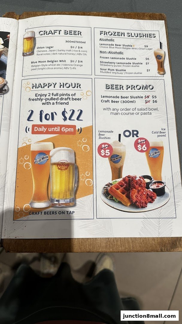 A menu featuring craft beers, frozen slushies, and a happy hour promotion with food.