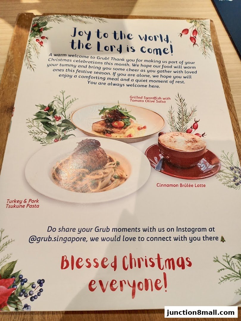 A menu featuring Christmas greetings and food items like pasta and latte.