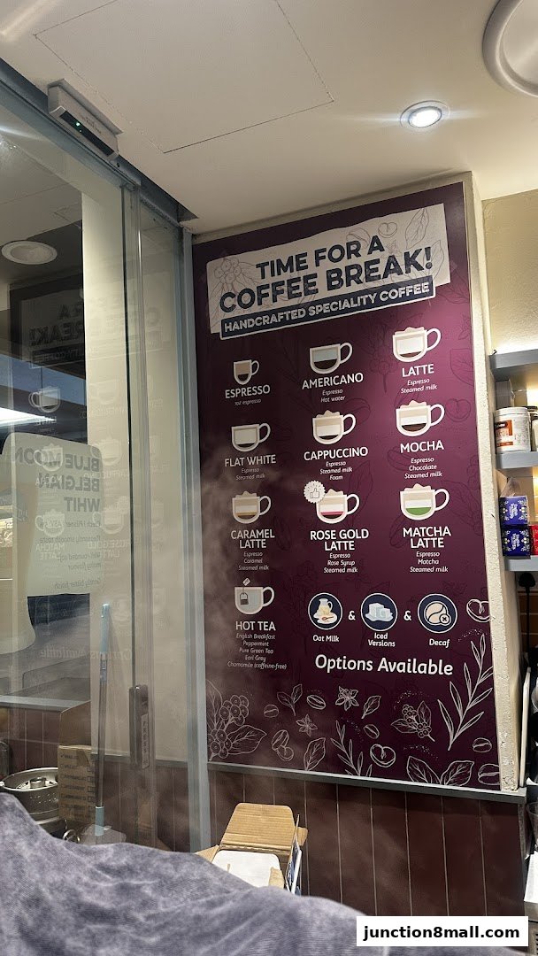 A menu board showcasing various handcrafted specialty coffees and hot teas.