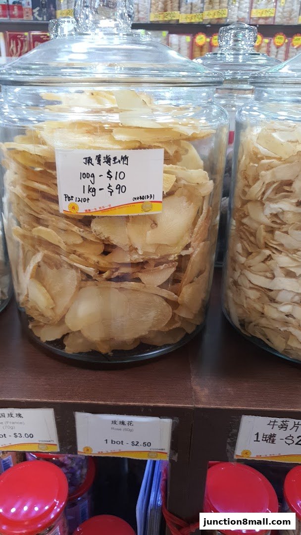 Jars of dried herbs and tonics displayed in a shop, with price labels visible.