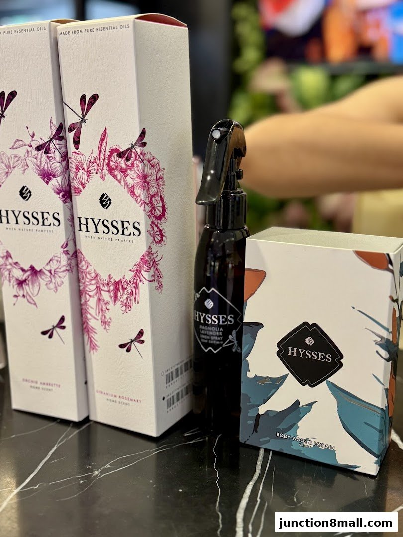 A collection of HYSSES branded essential oil products and body wash and lotion.