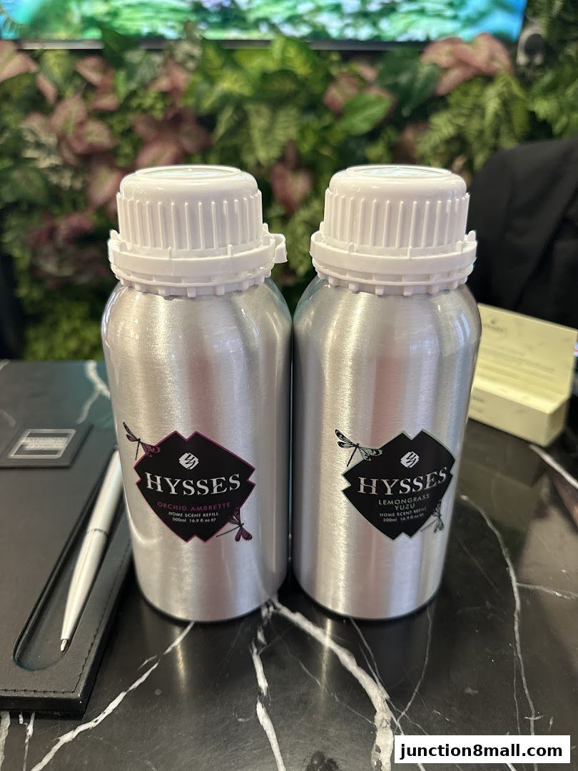 Two aluminum bottles of HYSSES home scent refills, Orchid Ambrette and Lemongrass Yuzu.