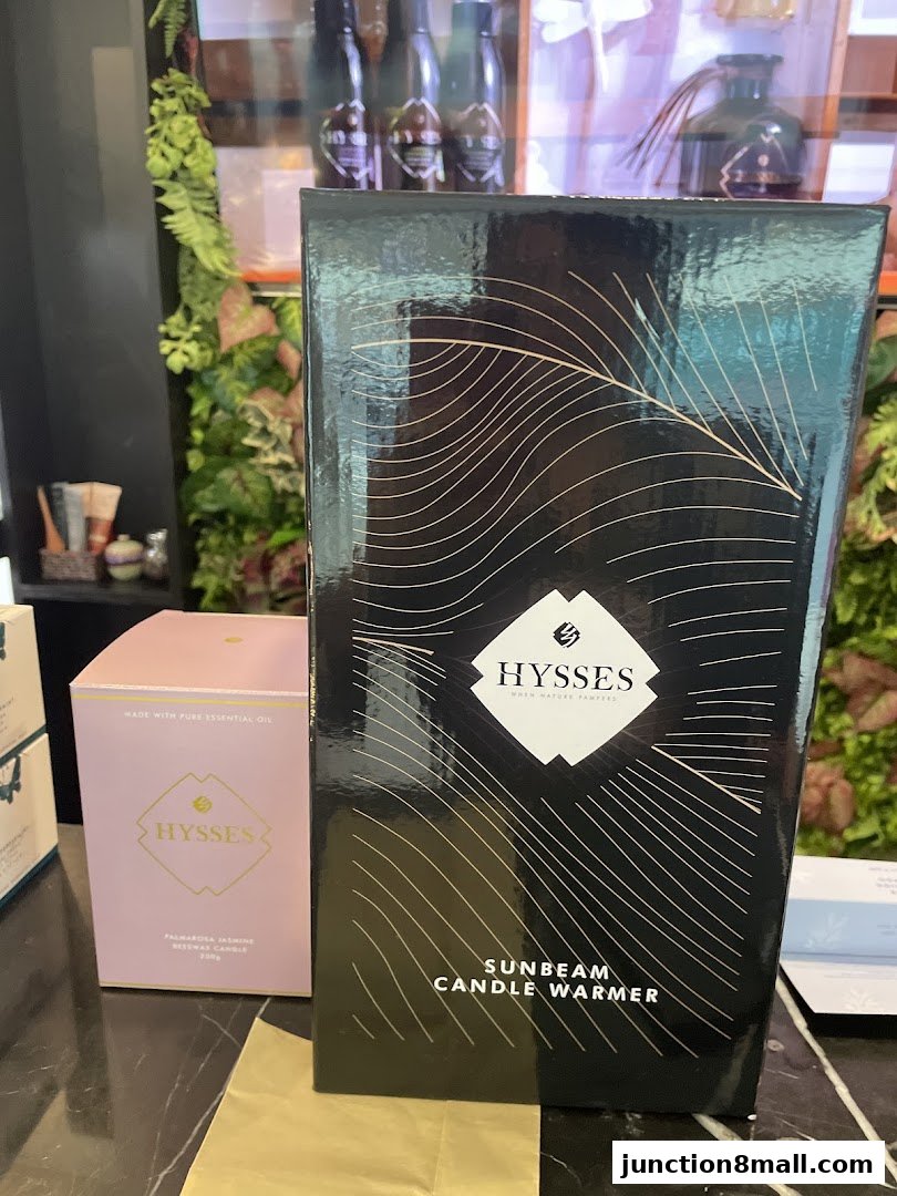 HYSSES branded products, including a candle warmer and a beeswax candle.