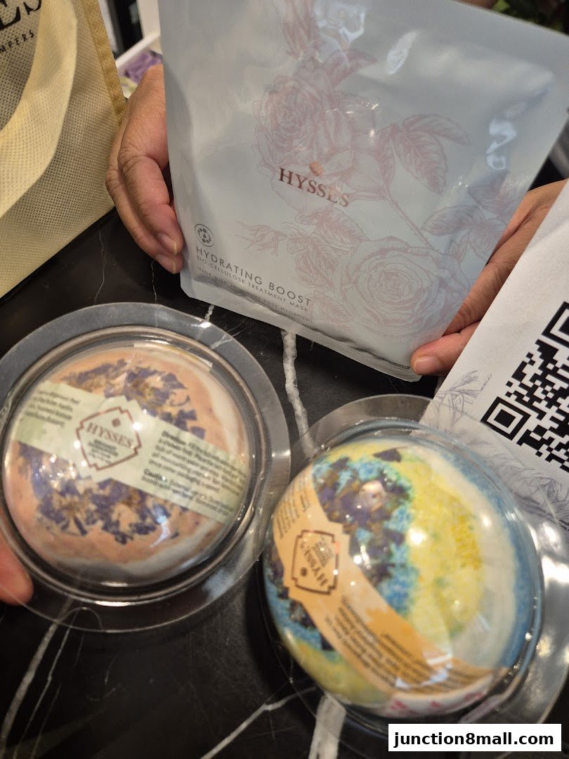Two bath bombs and a hydrating face mask from HYSSES are displayed.