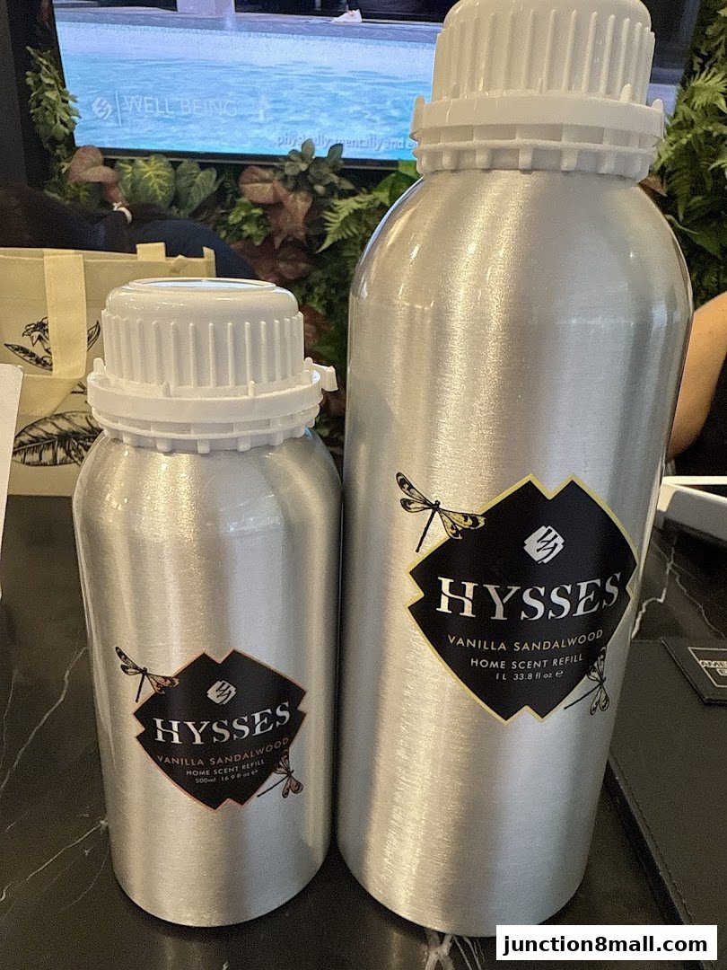 Two aluminum bottles of HYSSES Vanilla Sandalwood home scent refill.