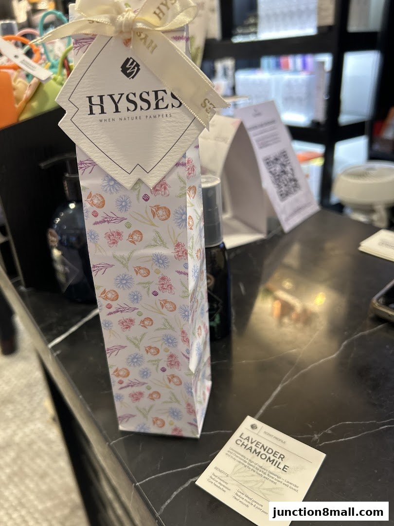 A product display at HYSSES, featuring a floral-patterned gift box and a scent profile card for Lavender Chamomile.