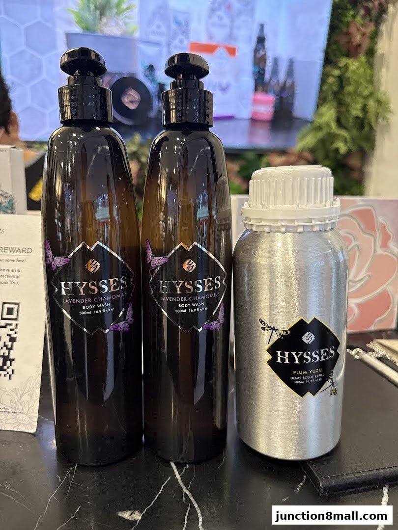 Three bottles of specialty oils from HYSSES, including two body washes and one home scent refill.
