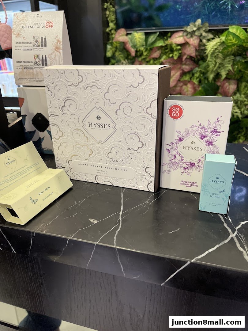 Hysses gift sets and body care products displayed on a marble counter.