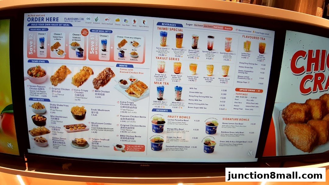 A digital menu board displaying various fried chicken, bubble tea, and Taiwanese street food options.