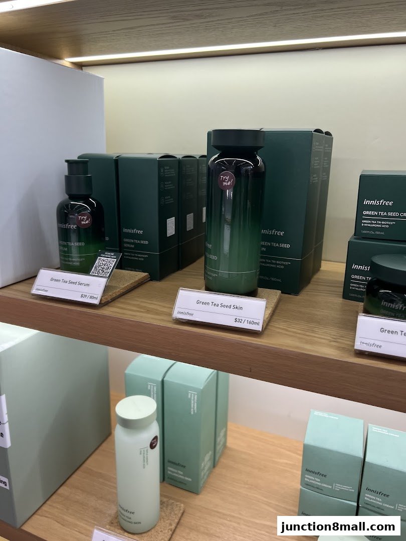 Innisfree shop display featuring Green Tea Seed Serum and Skin products.