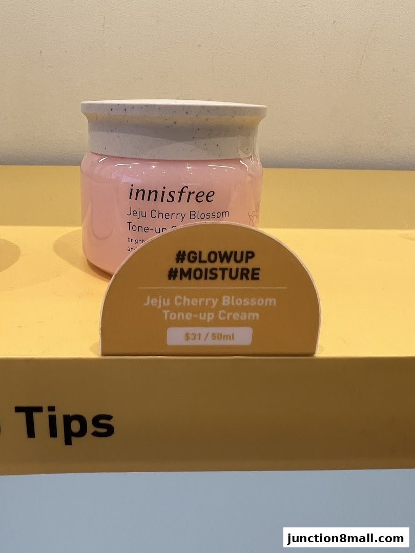 Innisfree Jeju Cherry Blossom Tone-up Cream displayed with its price and promotional hashtags.
