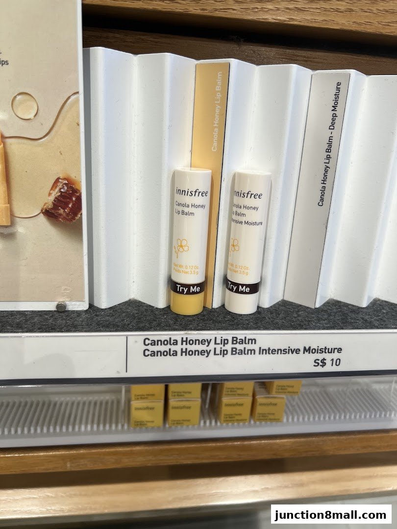 Innisfree Canola Honey Lip Balm products displayed with pricing and 'Try Me' tags.