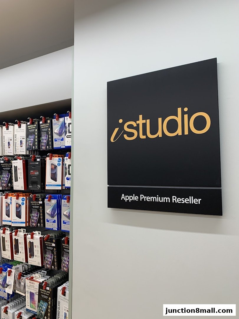 iStudio sign and shelves stocked with Apple accessories like phone cases and screen protectors.