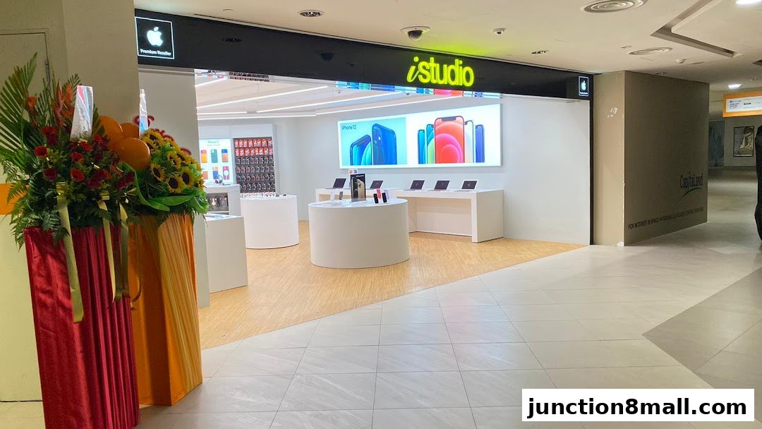 The entrance of an iStudio Apple Premium Reseller shop with displays of iPhones.