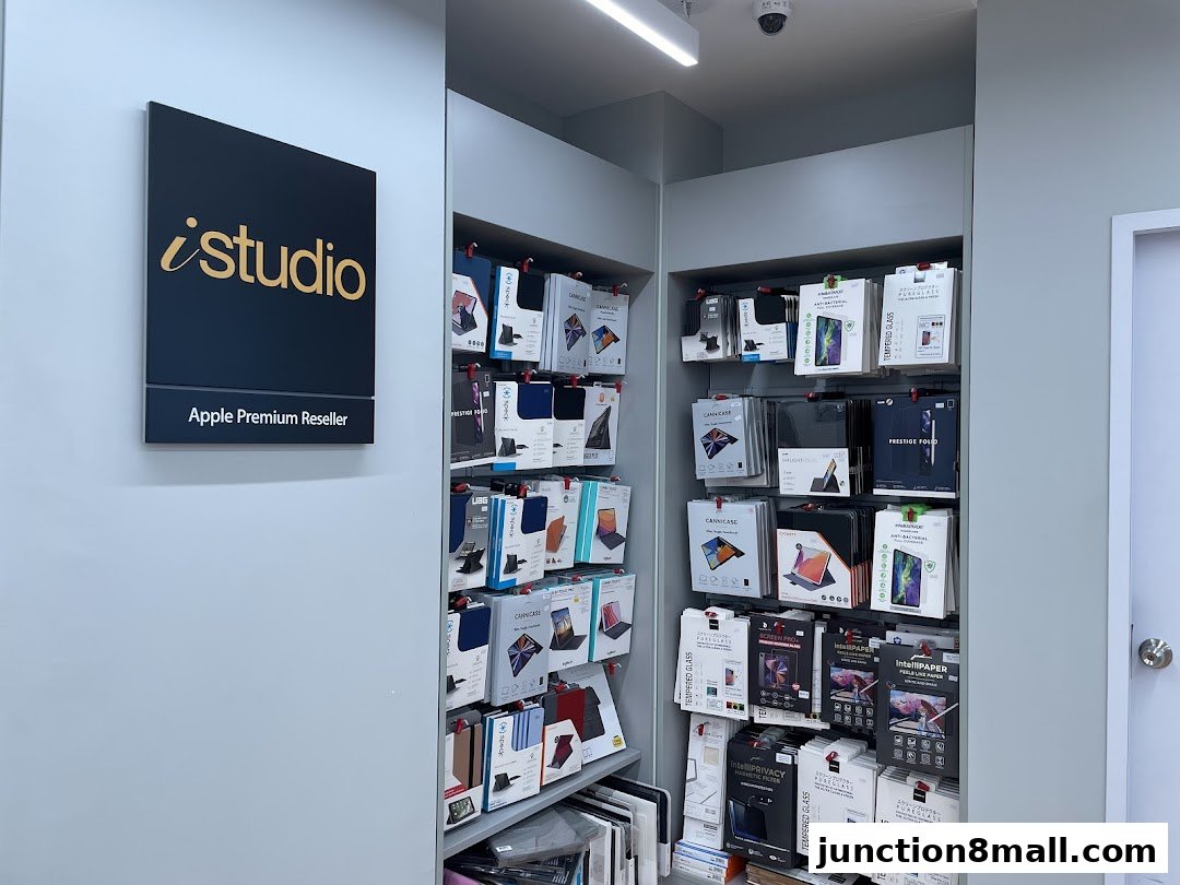 A retail store display featuring Apple accessories like cases and screen protectors.