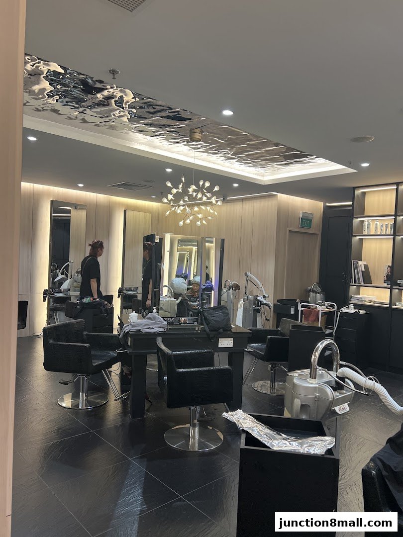 Interior of a modern hair salon with styling chairs, mirrors, and a unique ceiling.