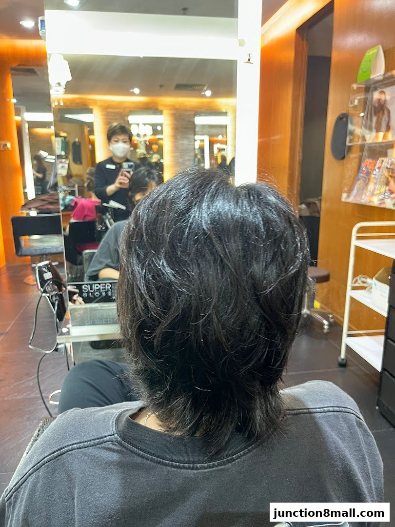 A person's back with a fresh haircut at Jean Yip Hairdressing.