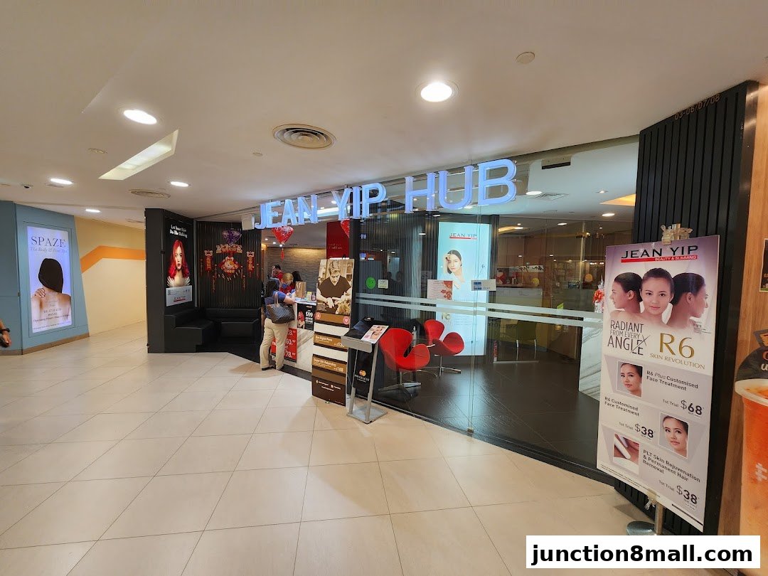 The entrance of Jean Yip Hub, a beauty and slimming salon, with promotional posters displayed.