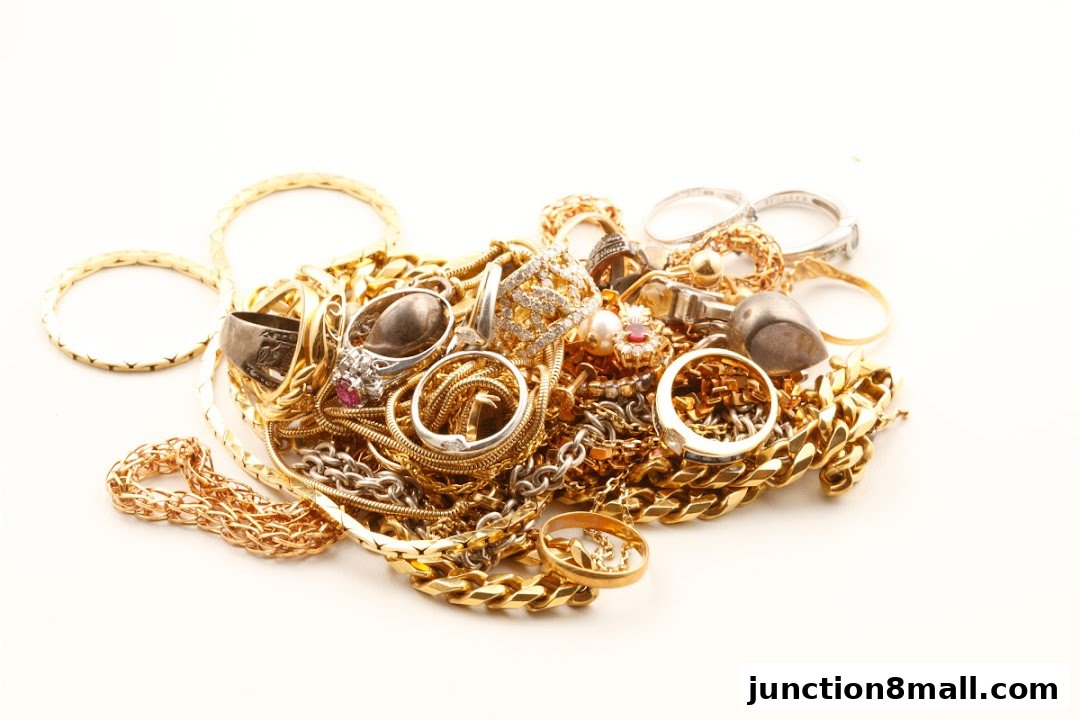 A pile of assorted gold and silver jewelry, including rings, necklaces, and bracelets.