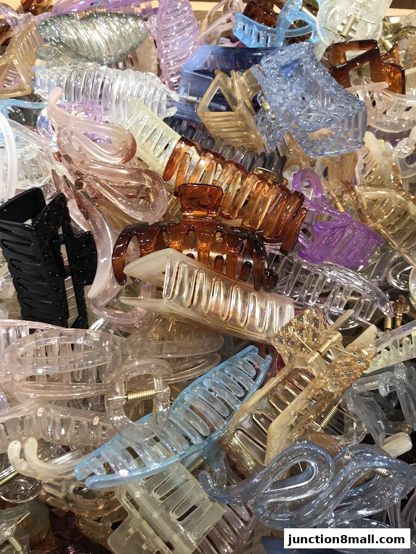 A large pile of colorful plastic hair claw clips in various shapes and sizes.