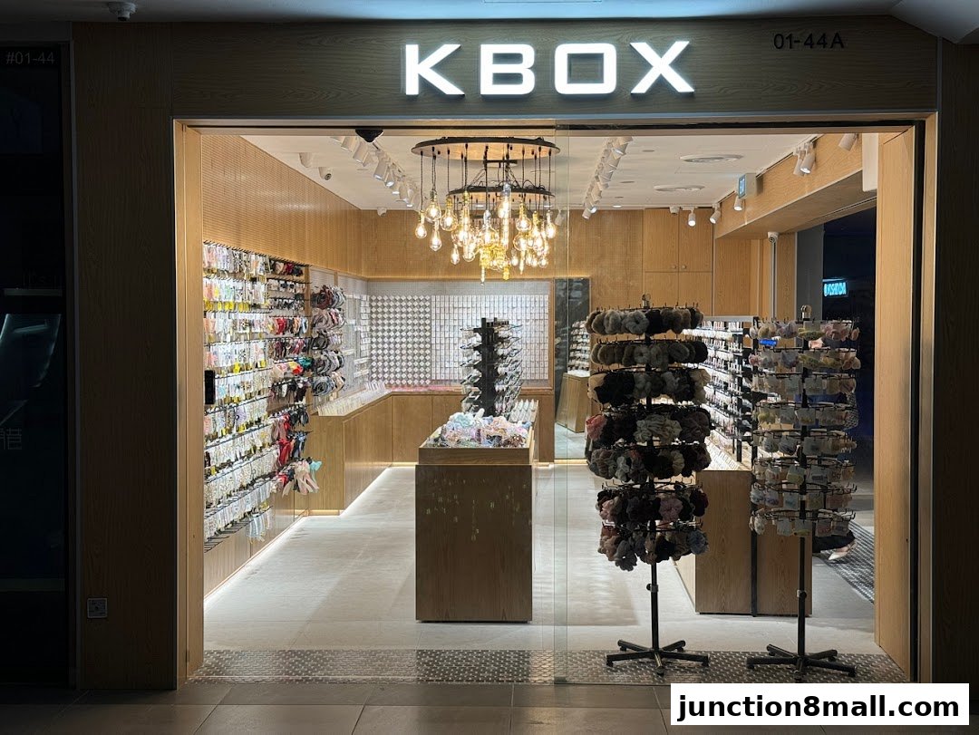 The KBOX shop front displays a wide variety of hair accessories and fashion items.