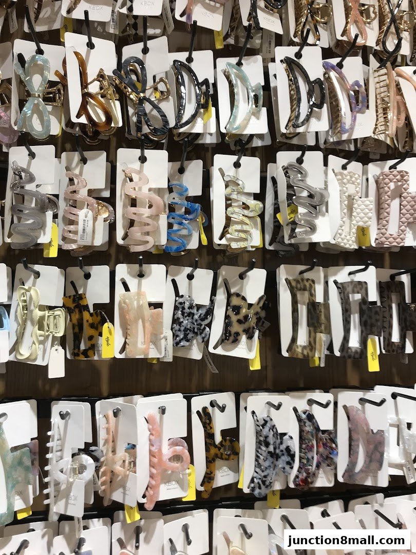 A wall display showcasing a variety of stylish hair claw clips in different colors and patterns.
