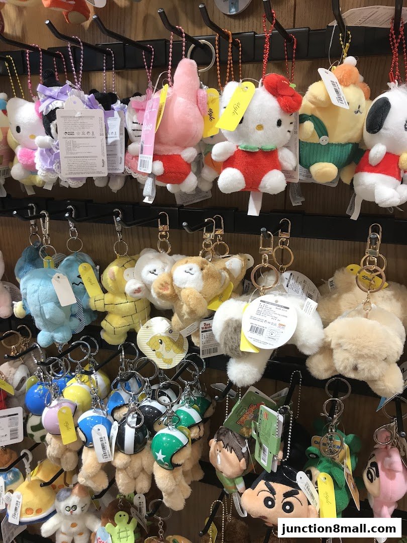 A display of various cute plush keychains and small stuffed toys.