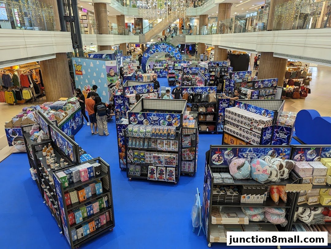 A Toy Story themed pop-up shop display in a shopping mall with various merchandise.