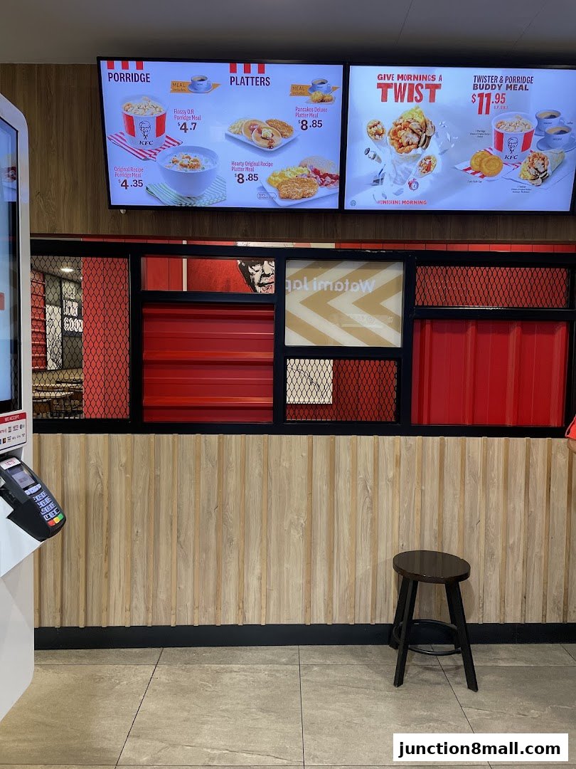 KFC menu board displaying porridge, platters, and buddy meals with prices.
