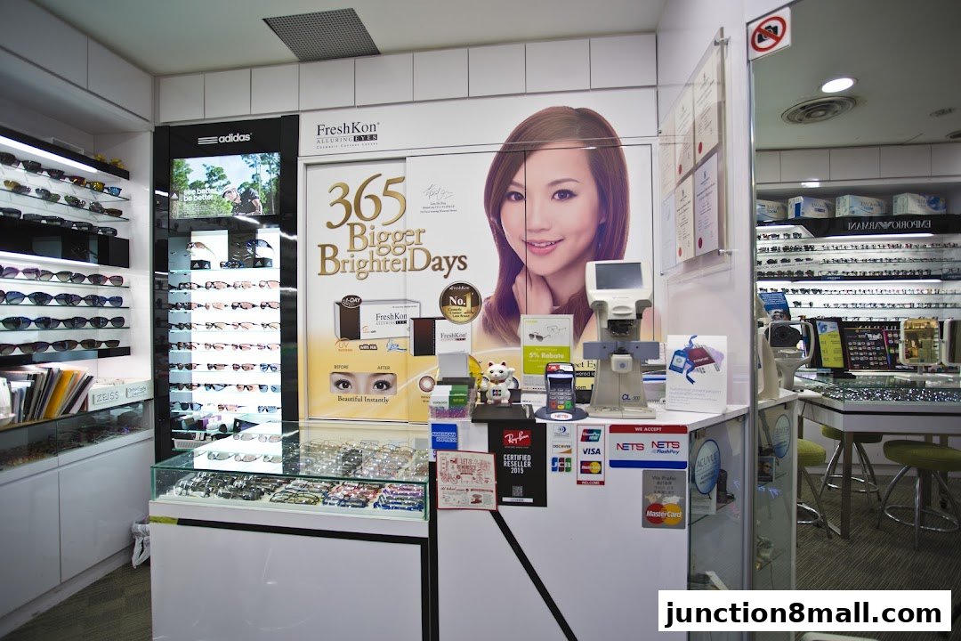 Interior view of an optical shop showcasing various eyewear and eye care products.