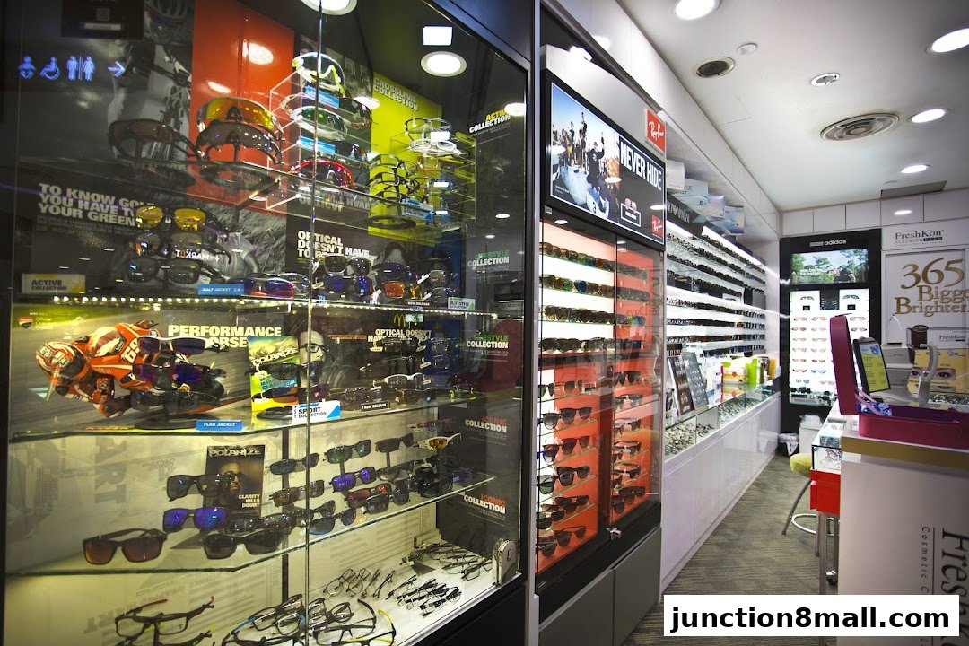 A well-lit optical shop displaying a wide variety of sunglasses and eyeglasses.
