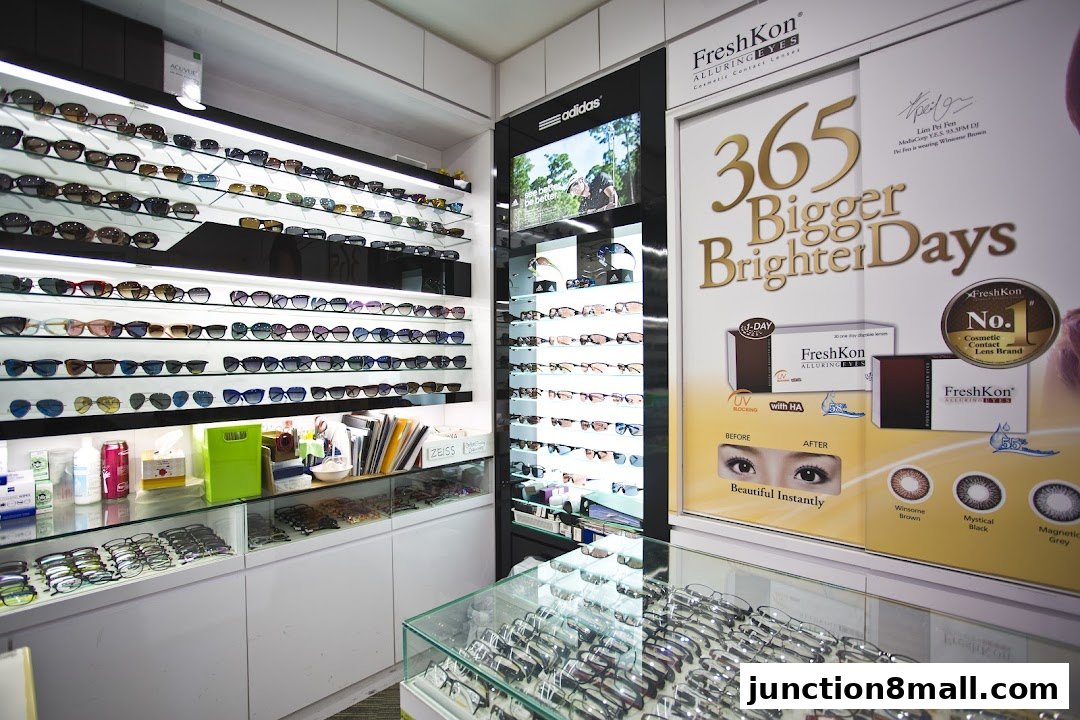 An optical shop interior displaying a wide selection of sunglasses and contact lenses.