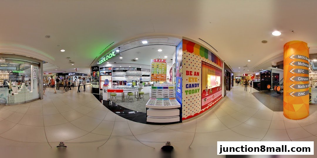A panoramic view of a shopping mall corridor featuring the Koolook eyewear store and other shops.