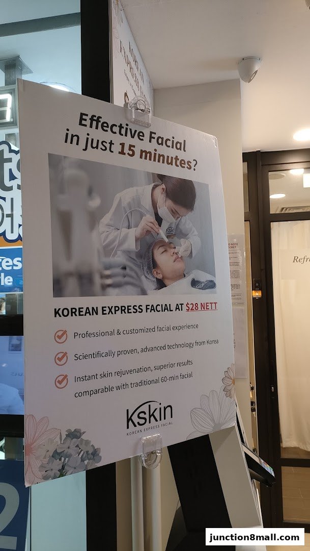 A sign advertising Kskin Korean Express Facial, highlighting a 15-minute facial for $28.