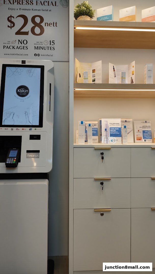 A Kskin Korean Express Facial kiosk and display shelves with skincare products.
