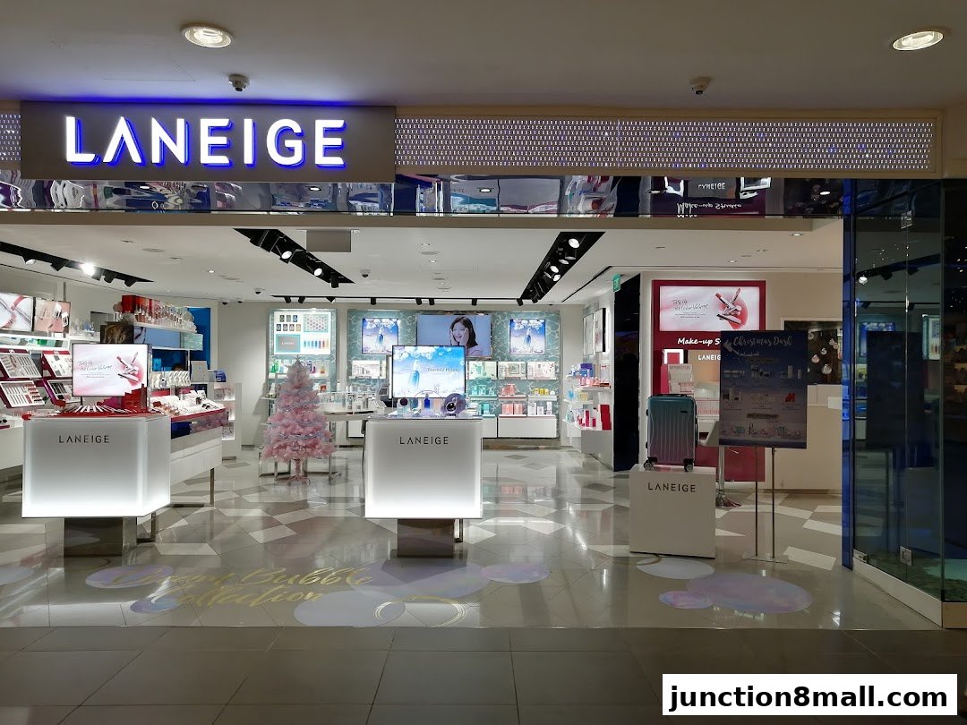The entrance of a LANEIGE beauty store, showcasing makeup and skincare products.