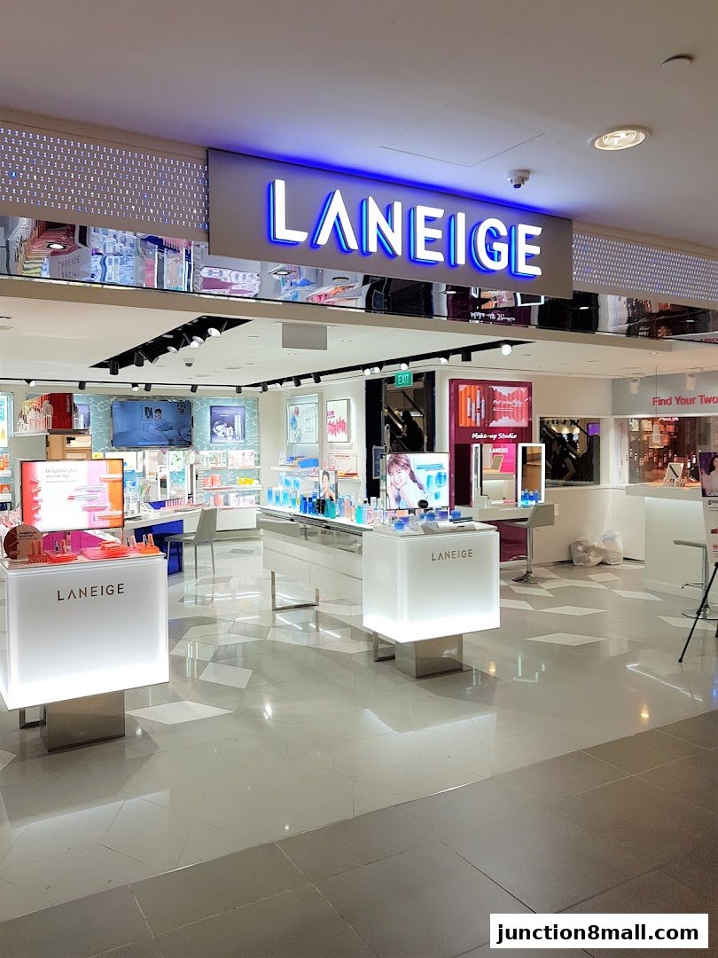 The LANEIGE store features a bright, modern interior with illuminated displays showcasing beauty products.