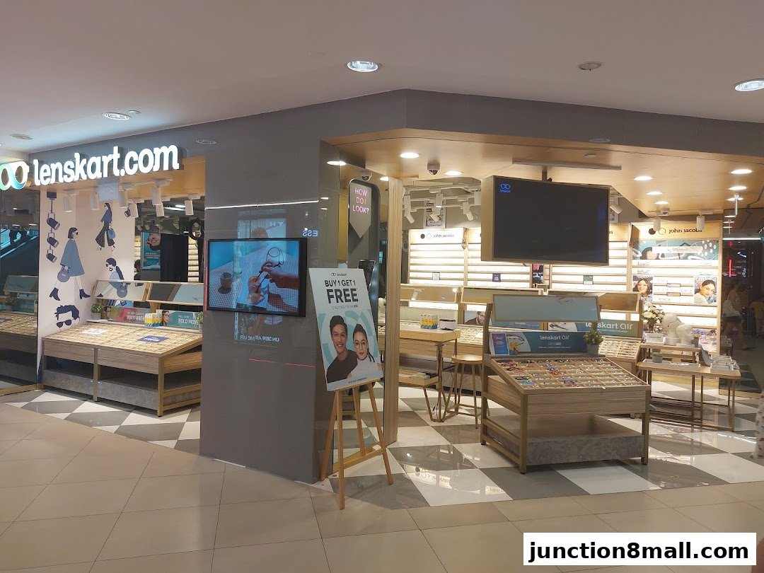 The Lenskart store interior displays various eyewear collections and promotional materials.