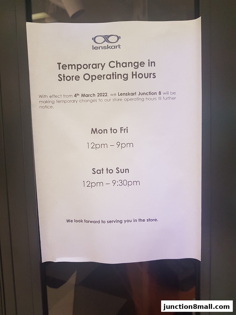 A sign announcing temporary changes to Lenskart Junction 8's store operating hours.