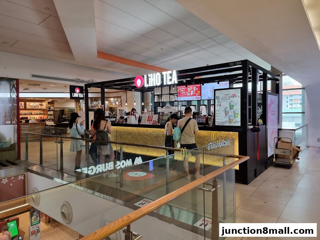 A LiHO TEA shop with customers ordering at the counter and promotional displays.